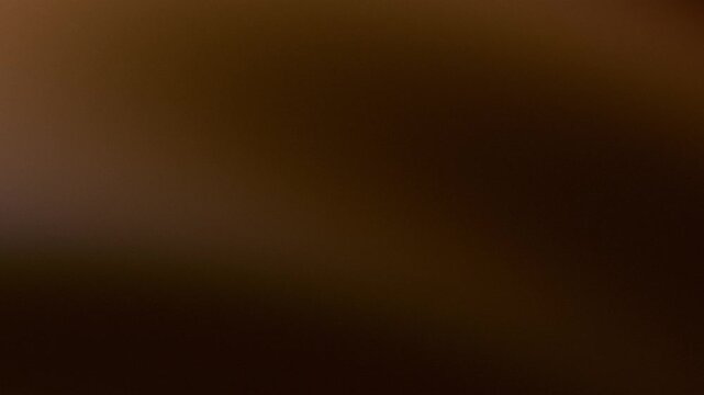 Warm brown and cool blue abstract gradient background with noise texture