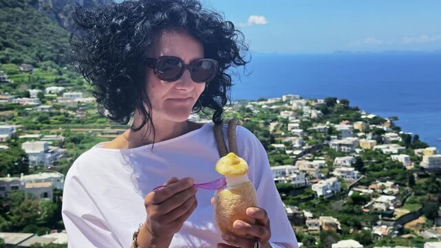 Woman Enjoying Lemon Sorbet Ice Cream on Sunny Capri Island
