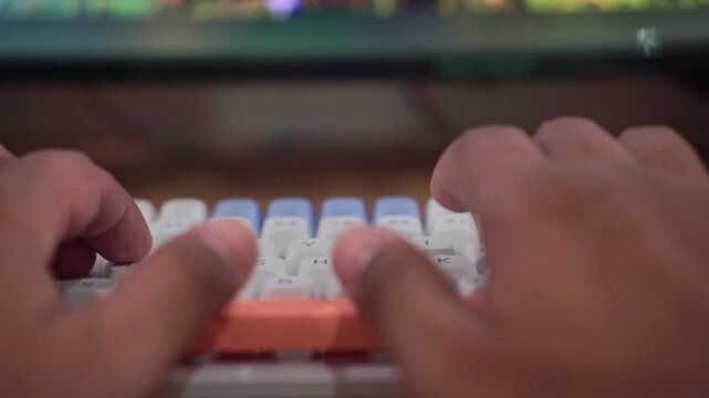 hands typing on mechanical keyboard with colorful keycaps. Gaming technology, computer workspace, close-up stock footage clip.