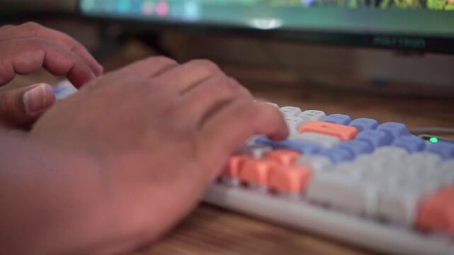 Person typing on colorful mechanical keyboard, computer work and digital technology concept.