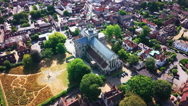 Drone shot of Romsey Abbey seen from above, framed by the war memorial park and surrounding town streets.