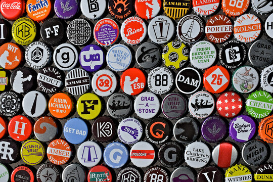 Collage of tightly packed bottle caps. The hobby of collecting Bottle caps is called &ldquo;Coronaphily&rdquo;