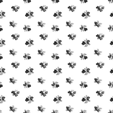 Seamless watercolor pattern with tiny black and gray hand painted flowers on a white background. Perfect for fabric, wallpaper, wrapping paper, stationery, packaging and home decor.