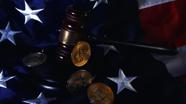 Judge's gavel and physical bitcoin coins resting on a United States flag, a conceptual video representing the legal framework, laws, regulation and legality of cryptocurrency in America
