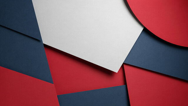 Abstract composition with layers of blue red and white paper creating modern geometric sharp shapes