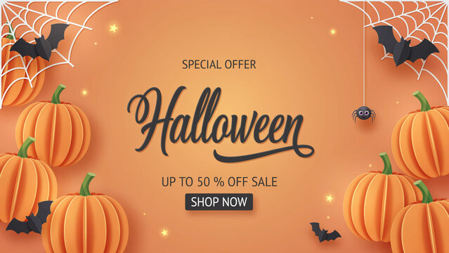 Halloween paper cut style banner with pumpkins bats spider web and stars on orange background