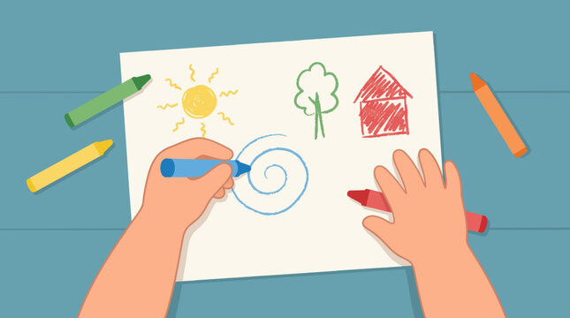 A child's hands are drawing on a piece of white paper with crayons. The drawing includes a sun, a tree, and a house. Crayons are scattered around the paper