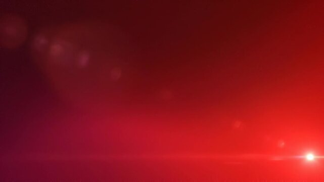 Red light flare with bright glowing lens effect and smooth gradient background for creative design