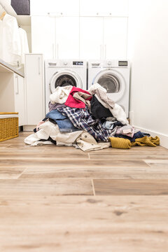 Pile of dirty clothes in laundry room