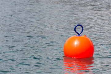 Red Buoy for safety swimming in water © Maria