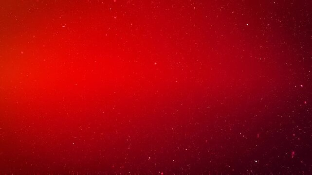 Red glowing light particles floating in dark space vibrant abstract background