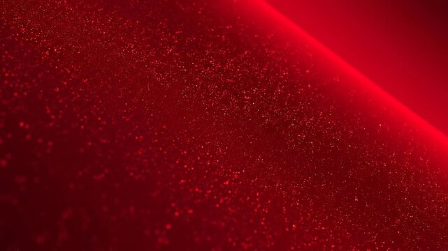 Red glitter texture background with sparkling particles and glowing light effect for festive design