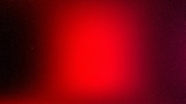 Abstract red gradient background with subtle texture and sparkling particles for creative design