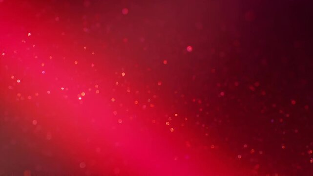Abstract red glitter bokeh background with sparkling light particles and vibrant texture for festive design