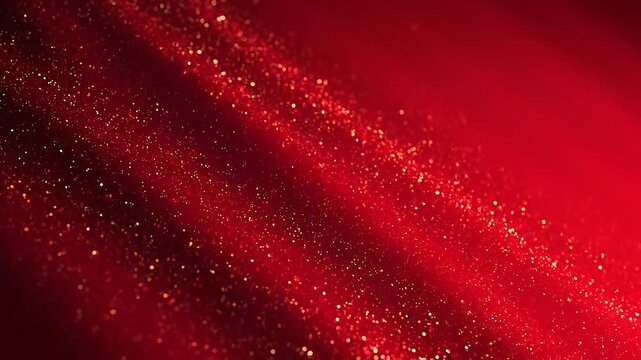 Close up of sparkling red glitter particles creating a festive and vibrant background with shimmering lights