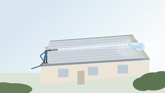 House roof cleaning worker pressure washing moss and grime from tiles, maintenance, exterior home care