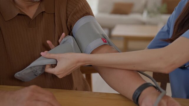Blood Pressure Measurement for Elderly Man During Medical Examination by Healthcare Professional Using Arm Cuff in Home Clinic Setting for Senior Patient Care and Routine Health Monitoring