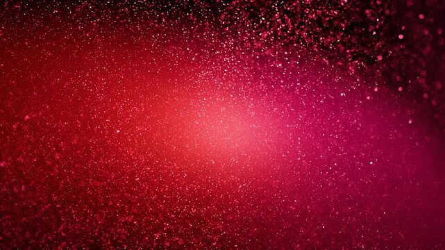 Abstract red glitter background sparkling with bright bokeh lights and festive vibrant particles