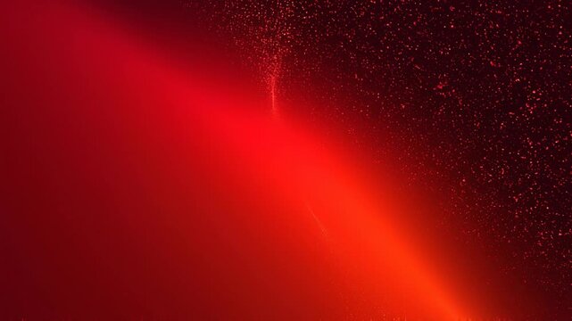 Abstract red light with particles and glowing effects creating a vibrant cosmic or futuristic background
