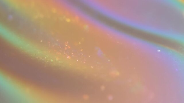 Abstract colorful iridescent light texture with soft rainbow hues and glowing reflections