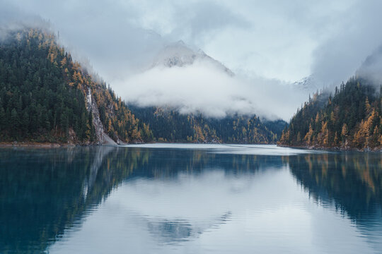 Scenery Jiuzhaigou national park in Sichuan, China. Beautiful Long lake and snow mountain in Autumn season. Famous Landmark and Vacation near Chengdu, China. Asia travel concept