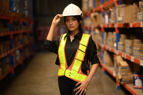 Warehouse worker working and checking the stock in the warehouse. .Factory manager using digital tablet check barcode in industry factory logistic.	