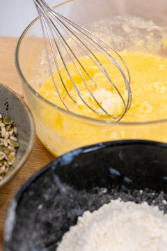 Cooking food. Whisking process. Mixing white wet ingredients batter for homemade pastry dough in glass bowl with culinary work tool.
