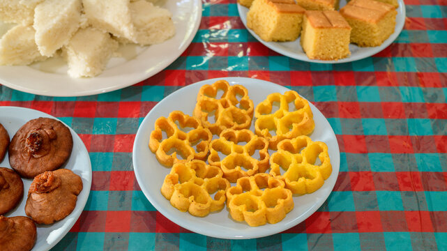 Traditional Sinhala Tamil New Year table with golden kokis and Sri Lankan festive sweets
