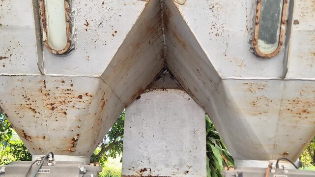 Bottom View of Industrial Metal Silo Hopper with Discharge Valves and Sight Glass Windows