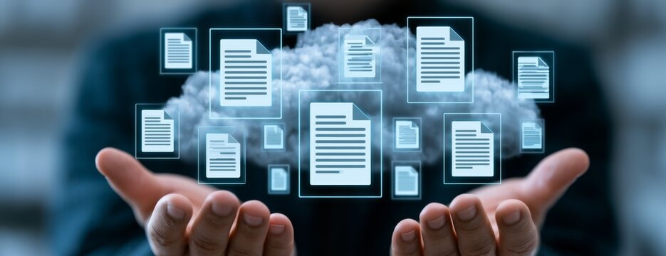 Office worker holding cloud of glowing document icons in hands  