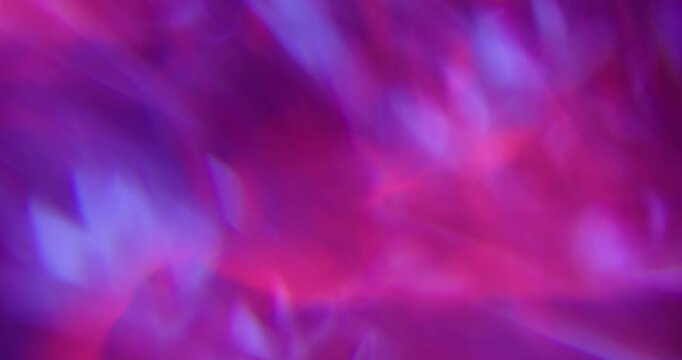 Blur rainbow abstraction. Light art. Pink blue purple colorful optical gleam texture glisten luminous reflection on vibrant neon background.