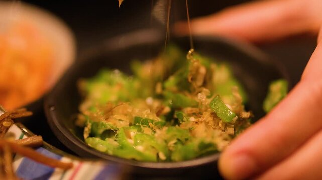 Eating Japanese Okra Salad with Bonito Flakes and Chopsticks
