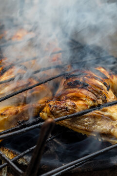 Grilled Chicken Cooking on a Charcoal Grill