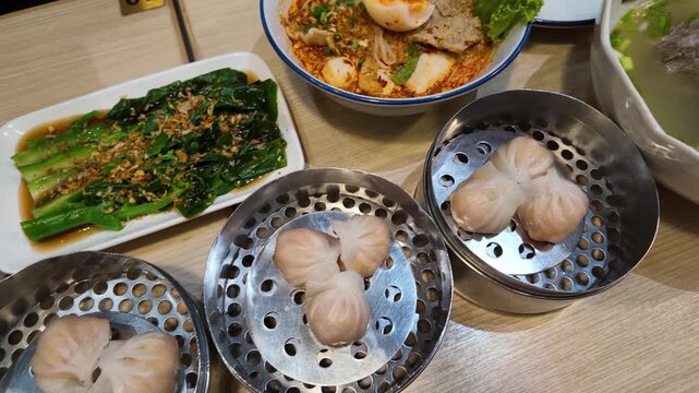 Steamed Shrimp Dumplings and Chinese Food Spread in Bangkok