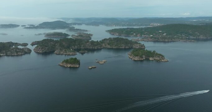 Aerial view of H&oslash;llen Norway coastal archipelago islands showing boat trail