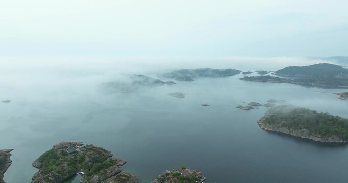 Aerial view of misty fjord islands in H&oslash;llen Norway