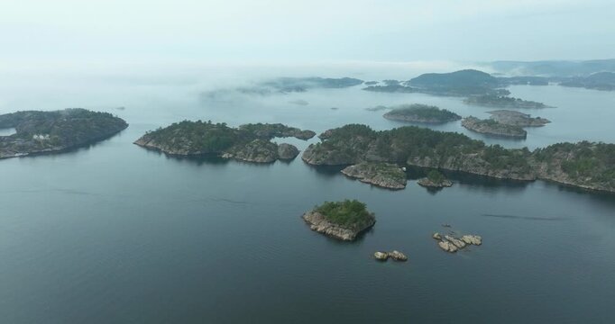 Aerial view of forested islands in Norwegian fjord waters