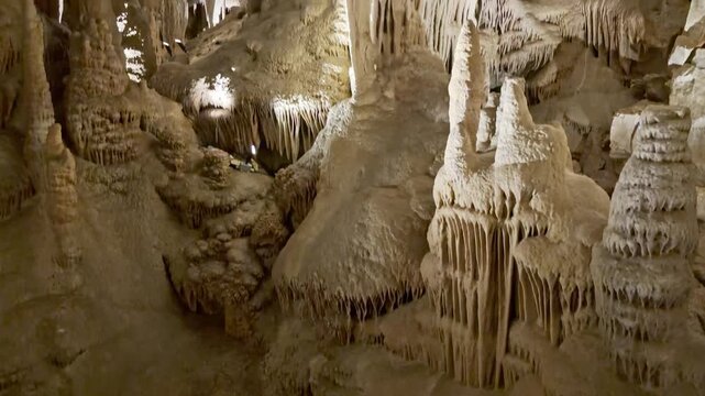 Dramatic view of illuminated limestone cave shields and intricate dripstone formations inside Lehman Caves Nevada