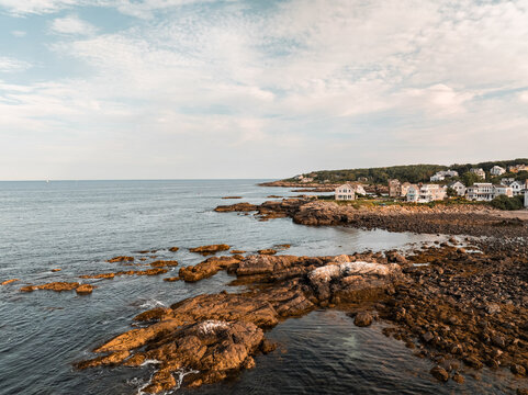 Drone Aerial Panoramic view of Coastal Maine town of Ogunquit. Beach and historic port along the rocky Atlantic trail of Marginal Way and get-away vacation homes.