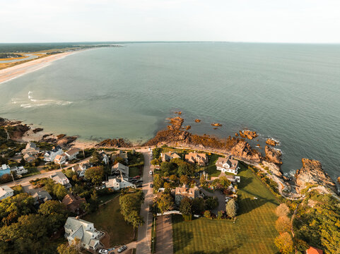 Drone Aerial Panoramic view of Coastal Maine town of Ogunquit. Beach and historic port along the rocky Atlantic trail of Marginal Way and get-away vacation homes.