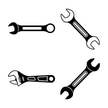 Four adjustable wrenches in different orientations on white background tools