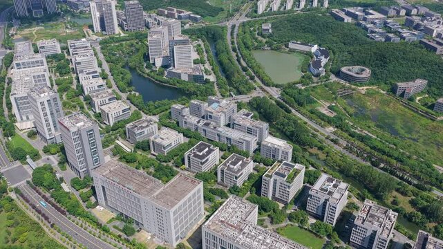 Drone gliding over a green urban district and landscaped park