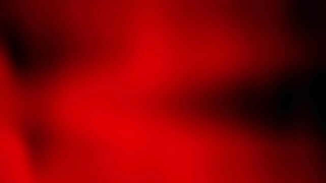 Abstract blurry red motion background with dark shadows and light leak effects