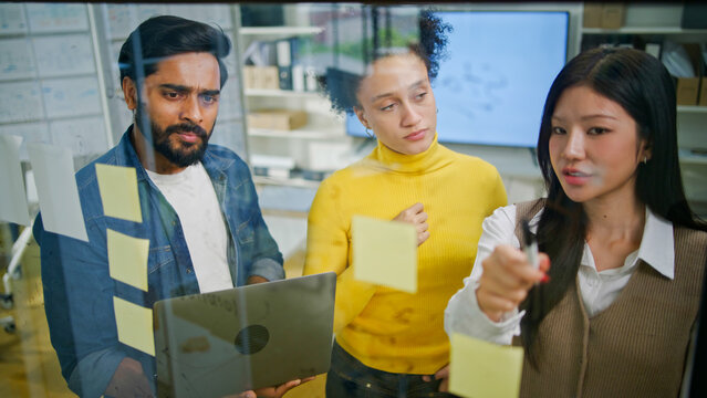Group of creative Businesspeople brain storm meeting presentation,discussing roadmap to product launch, planning,strategy,dashboard,new business development,working with new startup project in office