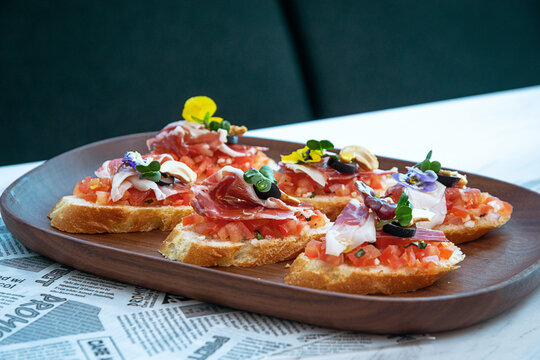 Gourmet Bruschetta Appetizers on Wooden Tray