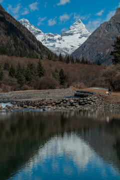 Fourth Peak of Mount Siguniang reflected in a mountain lake, Aba, Sichuan, China