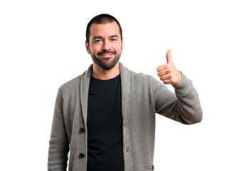 Fototapeta premium Smiling man in a grey cardigan showing a positive thumbs up gesture