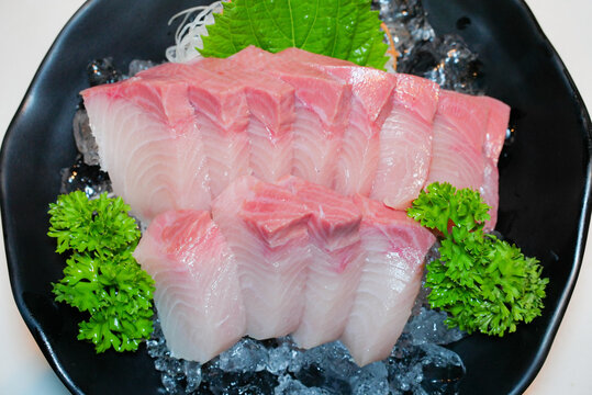 japanese yellowtail sashimi, sushi bar raw fish, luxury seafood plate, premium sashimi cut, seafood ice presentation, hamachi sashimi, yellowtail sashimi, raw fish japanese, fish on ice, sushi style, 