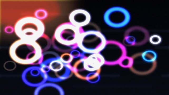 Colorful neon circles on dark background. 2d animation