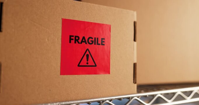 Shelf, boxes and logistics in warehouse with fragile label for shipping care or ecommerce safety. Cardboard, package sticker and distribution inventory, goods and protection caution in storage room